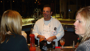 Volunteer serving drinks at the bar