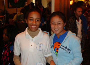 Two young guests smiling together