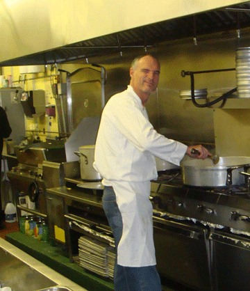 Volunteer cooking in the kitchen