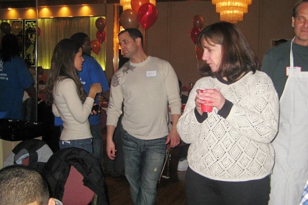 Volunteers and guests talking in the hall