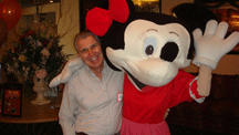 Guest posing with a costumed character
