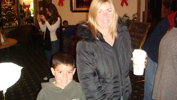 Guest and child with a warm drink