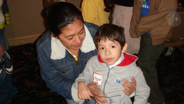 Mother holding her son at the event
