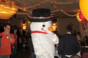 Snowman character dancing through the hall