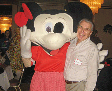 Guest posing with a costumed character