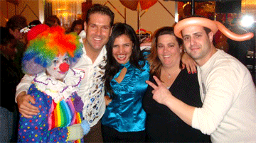 Clown posing with volunteers